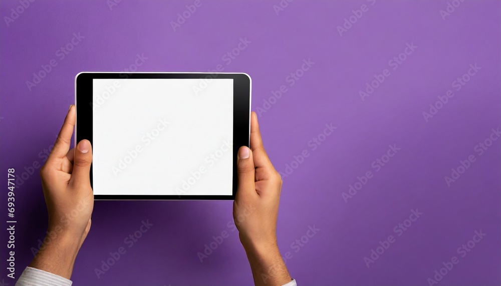 Hands holding white screen tablet, isolated on purple background Hands holding white screen tablet, isolated on purple background
