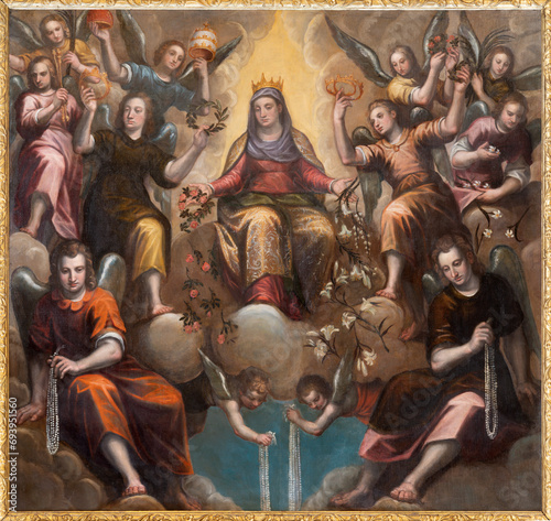 VICENZA, ITALY - NOVEMBER 7, 2023: The baroque painting of Virgin of the Rosary in presbytery of the chruch Chiesa di Santa Corona by  Alessandro Maganza ( 1556 – 1632).