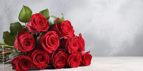 Fototapeta Naklejka Na Ścianę i Meble -  luxury bouquet of fresh red roses on light background, banner, copy space