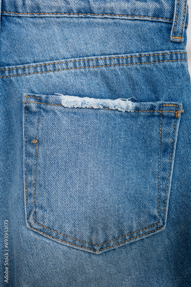 Close up of back pocket of jeans pants denim