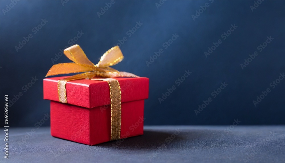Red gift box and blue background, text space, christmas concept
Red gift box and blue background, text space, christmas concept