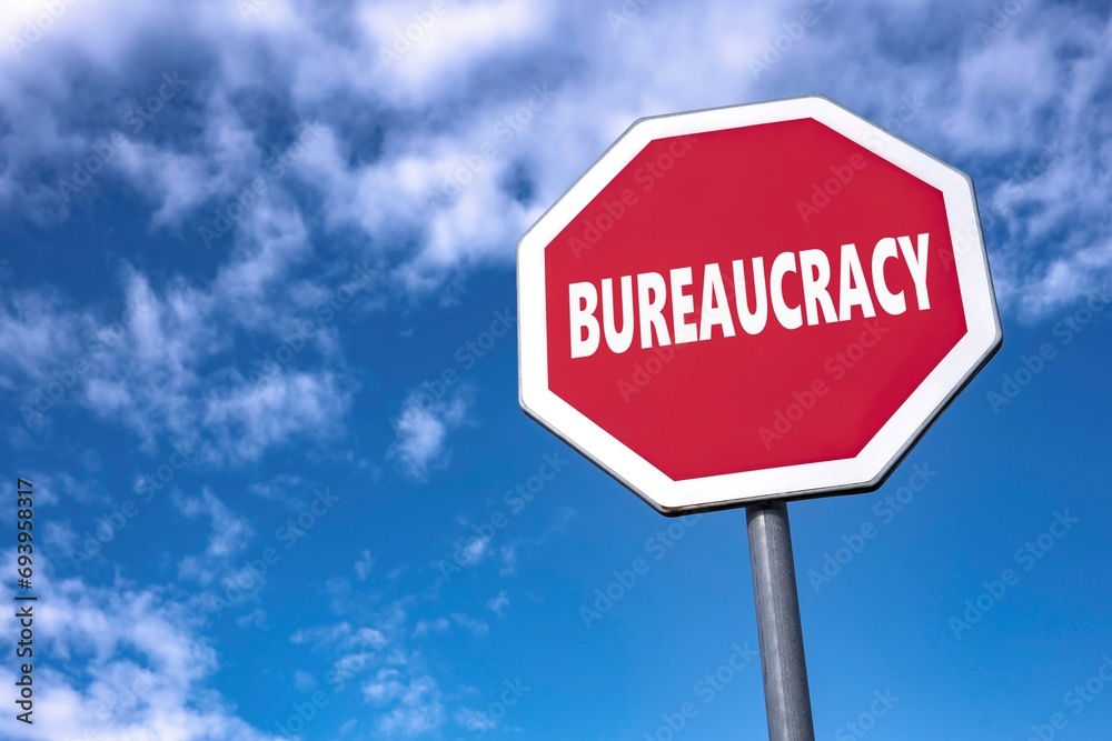 Traffic sign with text BUREAUCRACY to stop unnecessary laws and rules Traffic sign with text BUREAUCRACY to stop unnecessary laws and rules