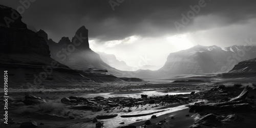 A black and white photo capturing the beauty of a mountain valley. This image can be used to evoke a sense of tranquility and awe. © Fotograf