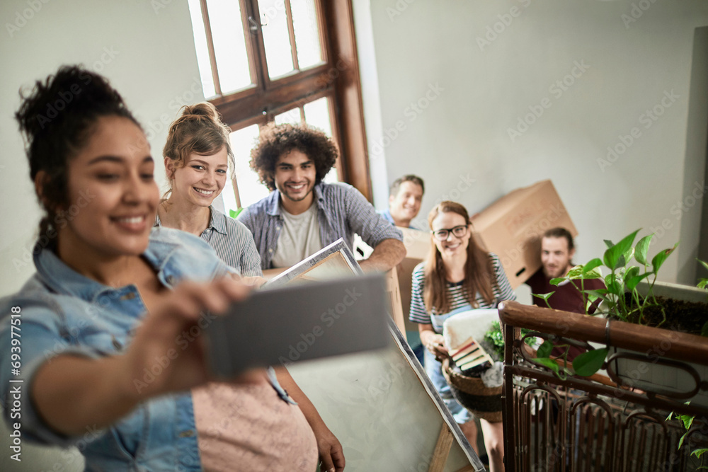 Diverse young people taking selfie while moving boxes to dorm Diverse young people taking selfie while moving boxes to dorm