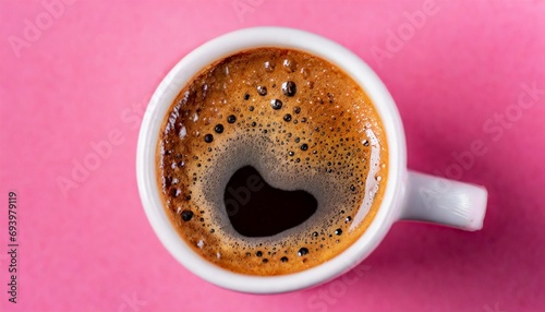 Cup of coffee over pink background © adobedesigner