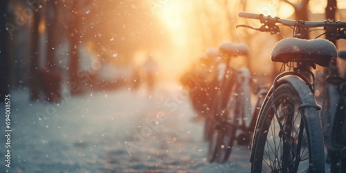 Bicycles lined up in a row, parked in the snow. Suitable for winter-themed designs and outdoor activities