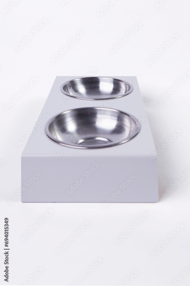 Dry dog and cat food in metal bowl, top view and flat lay Dry dog and cat food in metal bowl, top view and flat lay