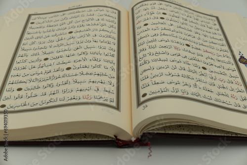 Photograph of the holy Quran taken on a white background, in Konya, Turkey, on December 16, 2023