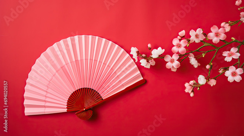  Japanese folding fan in red  with cherry blossom for  copy space 