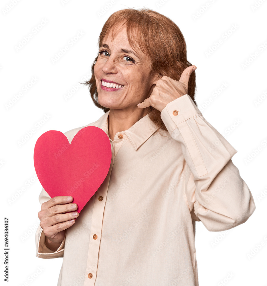 Middle-aged Caucasian woman with Valentine's heart expressing emotions Middle-aged Caucasian woman with Valentine's heart expressing emotions