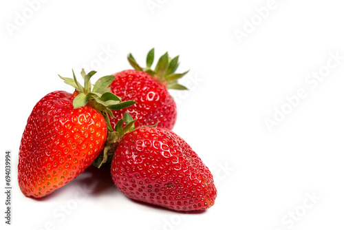 Fresh red strawberries on a white background, sweet strawberries for dessert