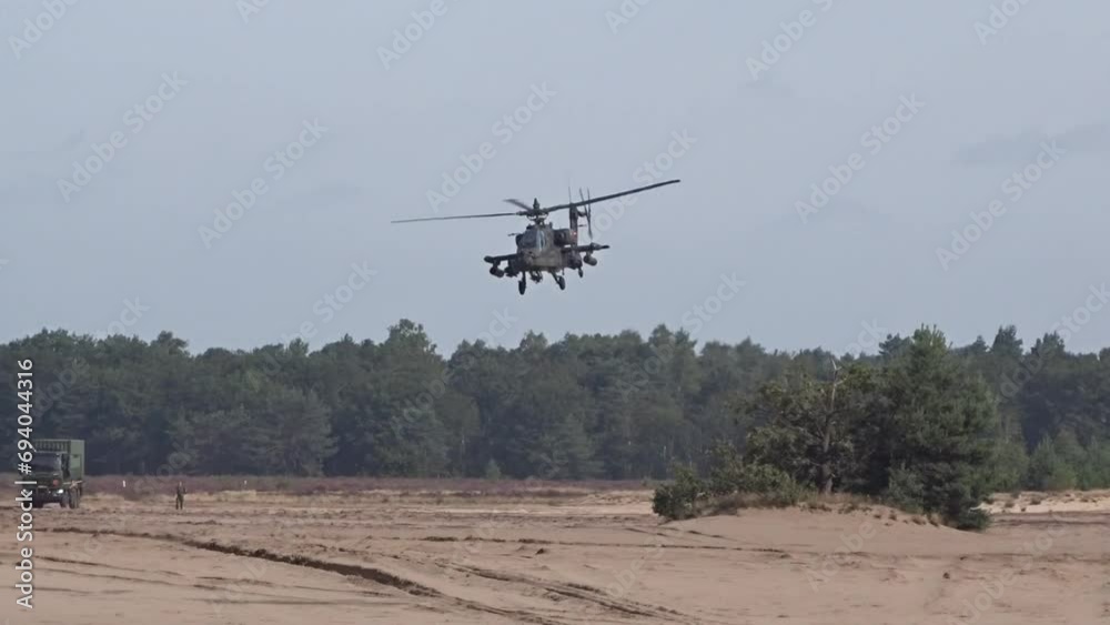 Military Helicopter flying low between trees Military Helicopter flying low between trees