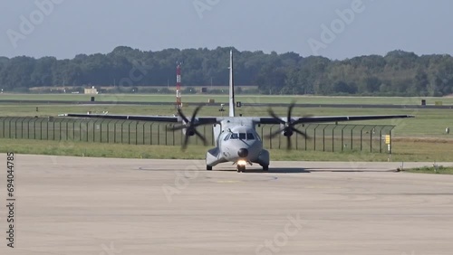 Small Casa Military Transport Aircraft from air force Taxiing at Air Base after landing turning on the taxiway