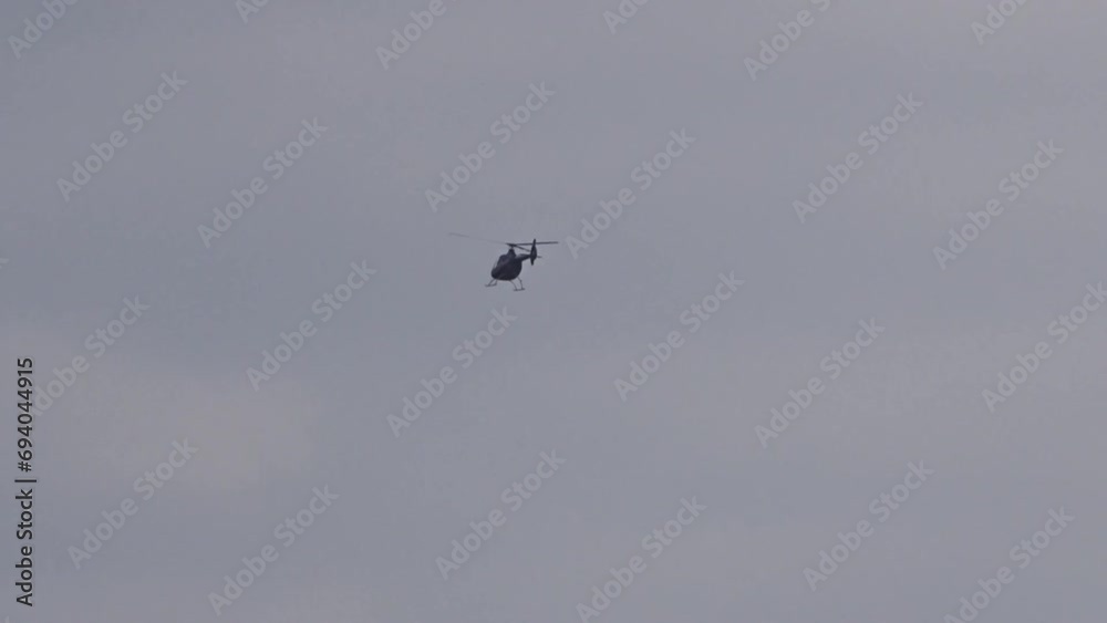 Helicopter Hovering Fly Over Flying flypast Low in the Distance Helicopter Hovering Fly Over Flying flypast Low in the Distance