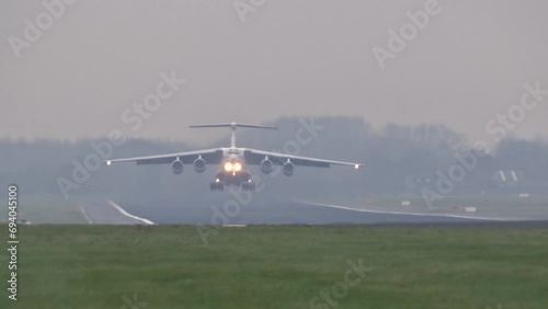 Heavy Old and Banned Russian Transport Airplane Aircraft IL-76 Taking off at Airport photo