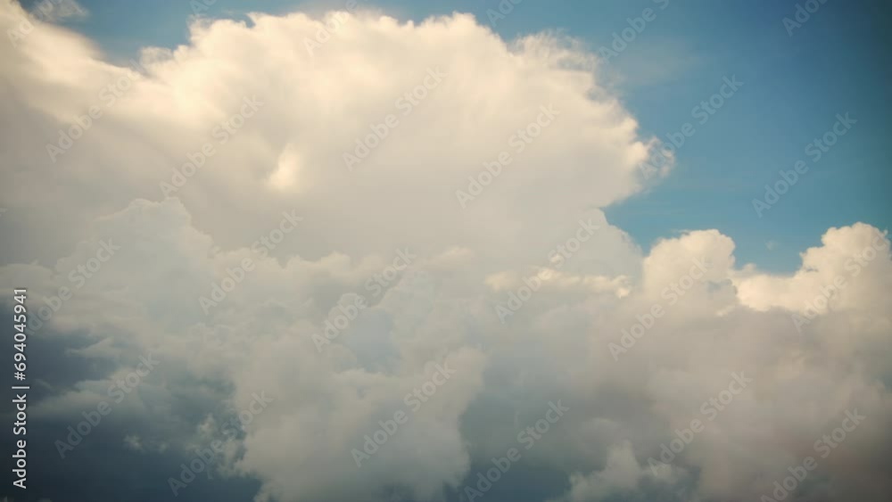 Big white clouds, view from the plane porthole
