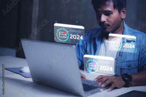 Businessman using laptop computer to check email notifications with icons or hologram online communication technology concept
Communication concept 2024