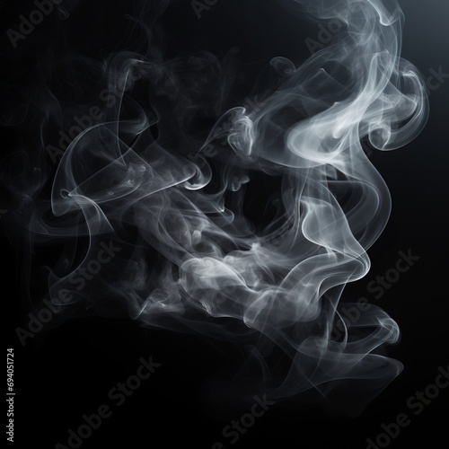 Whisps of white smoke elegantly swirl against a pure black background photographed in slow motion   the harm of smoking. Dark ink spilled in the water. Healthy lifestyle concept.