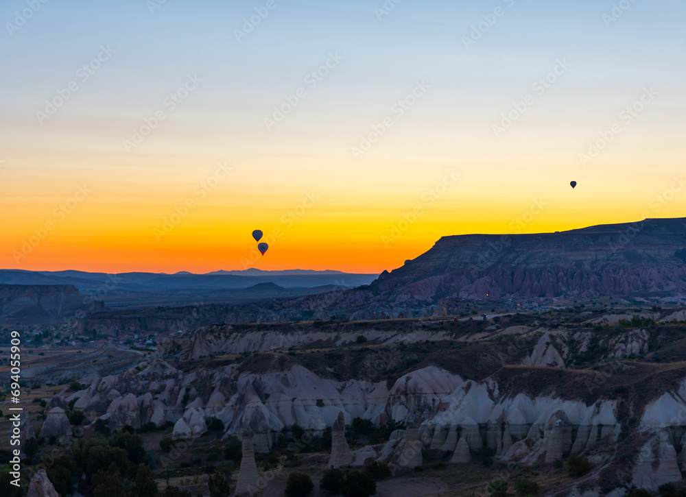 Naklejka premium Hot Air Balloons Over Love Valley in Cappadocia, Turkey At Sunrise. 