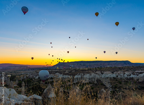 Hot Air Balloons Over Love Valley in Cappadocia, Turkey At Sunrise. 