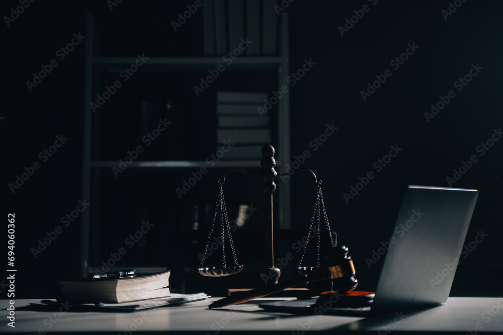 Business and lawyers discussing contract papers with brass scale on desk in office. Law, legal services, advice, justice and law concept picture with film grain effect - obrazy, fototapety, plakaty 