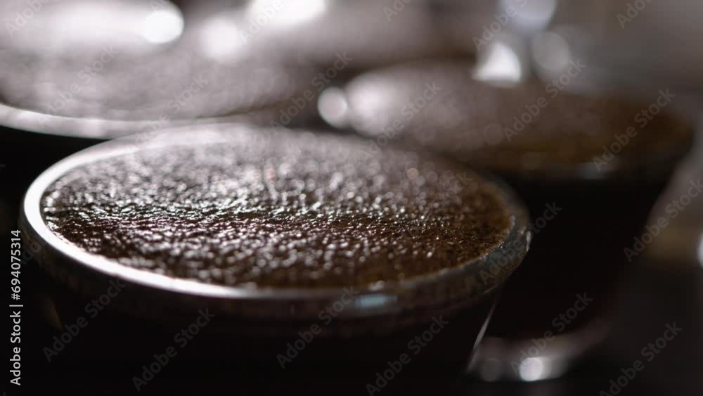 Cupping process in specialty coffees produced on farms in Brazil, testing coffee roasting, hot water being used com ground coffee, making a great aroma