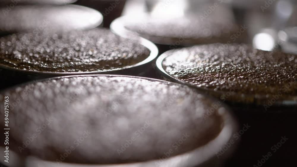 Cupping process in specialty coffees produced on farms in Brazil, testing coffee roasting, hot water being used com ground coffee, making a great aroma