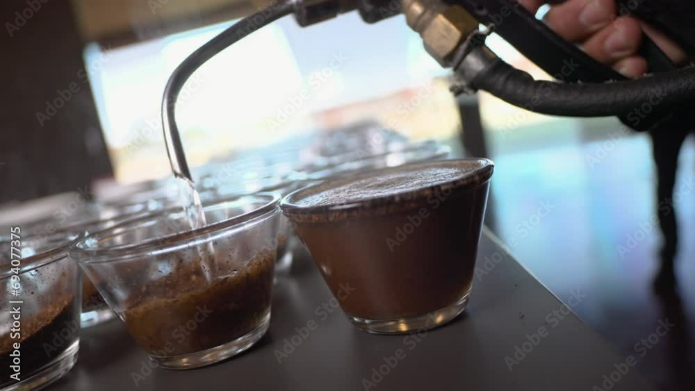 Cupping process in specialty coffees produced on farms in Brazil, testing coffee roasting, hot water being used com ground coffee, making a great aroma