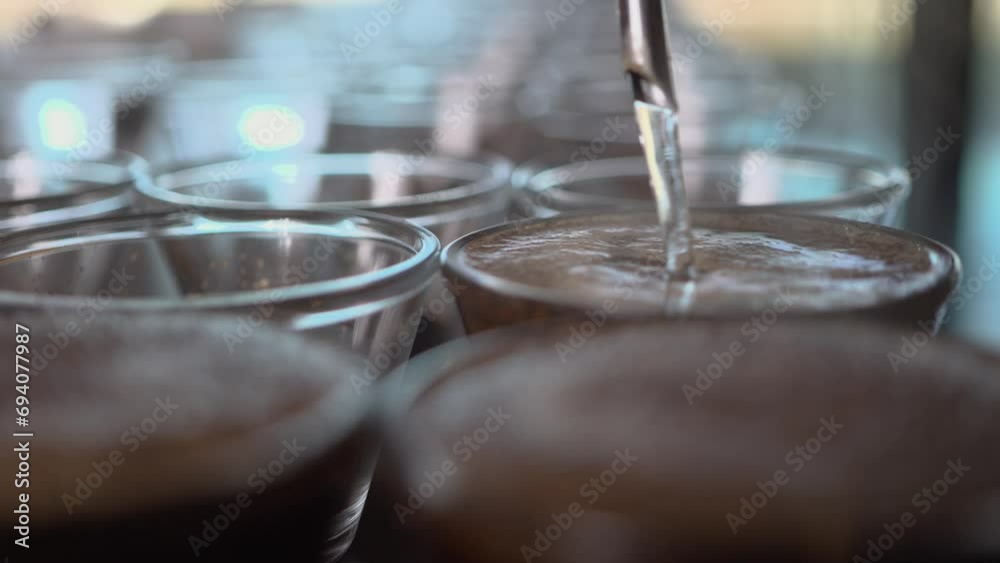 Cupping process in specialty coffees produced on farms in Brazil, testing coffee roasting, hot water being used com ground coffee, making a great aroma