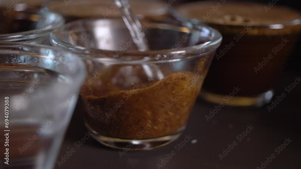 Cupping process in specialty coffees produced on farms in Brazil, testing coffee roasting, hot water being used com ground coffee, making a great aroma