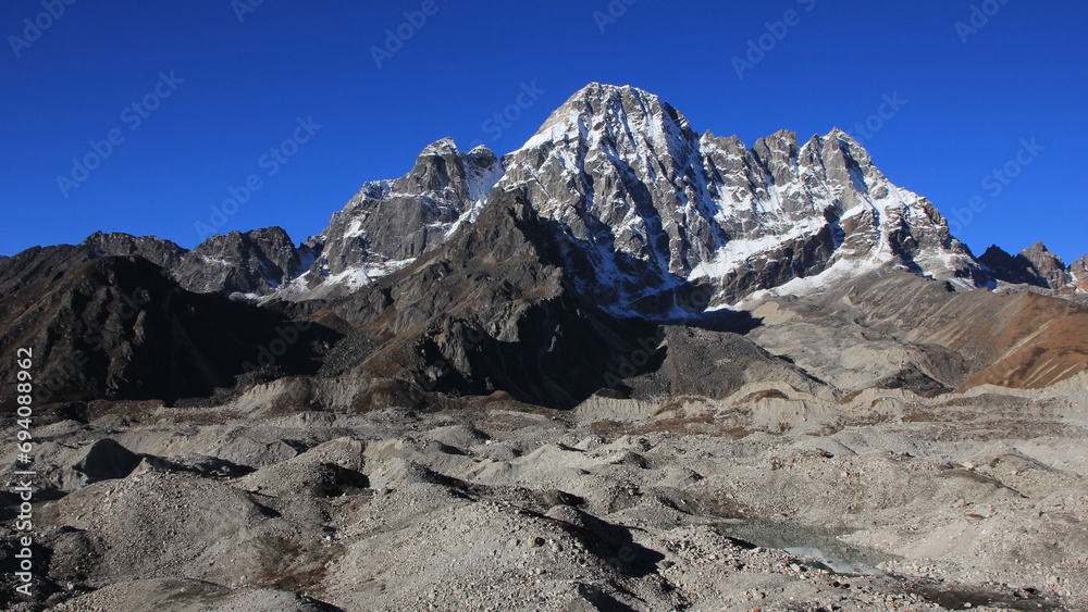 Ngozumpa Glacier and high mountains seen from Dragnang, Nepal.