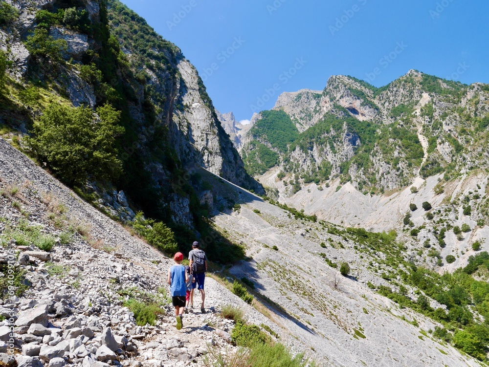 Family hiking to Sopoti Waterfall, Albania.