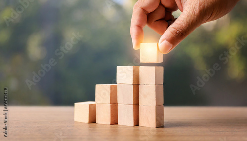 business growth concept, hand putting top wood block stacking step