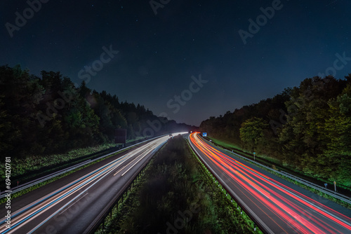 Starry night over a bustling highway in motion