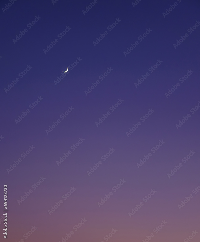 First quarter moon on the colorful sunset sky, can be used as a background. First quarter moon on the colorful sunset sky, can be used as a background.