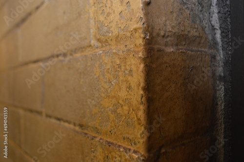 chipped painted brick wall corner
