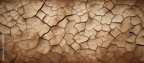 Dry, cracked earth during a drought's beginning