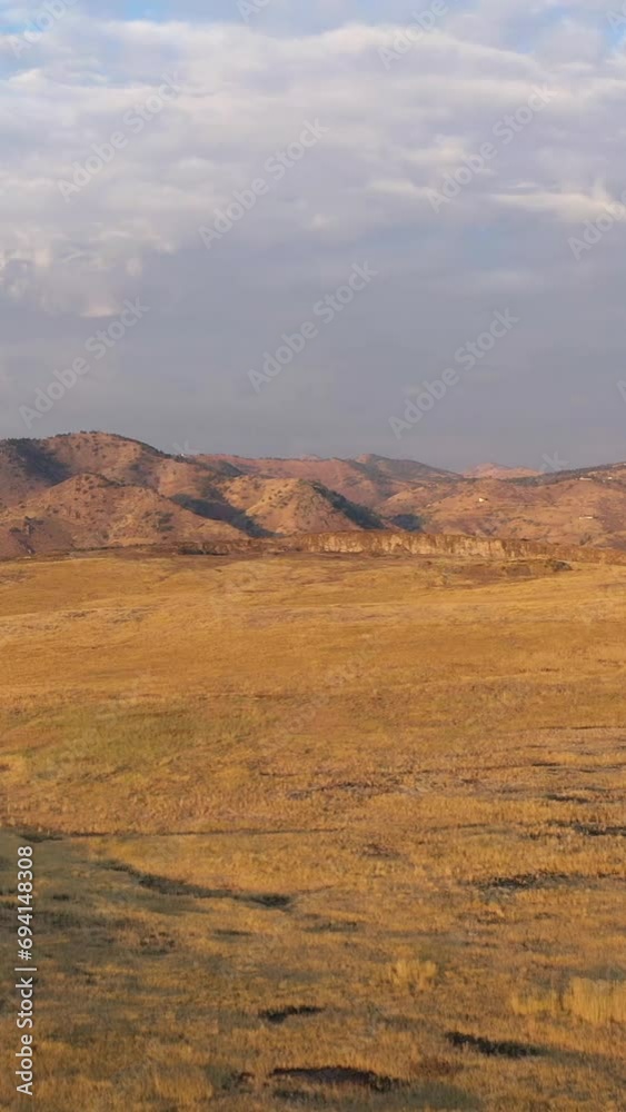 North Table Mountain Park in Autumn Sunny Morning. Aerial View. Golden, Colorado, USA. Drone Flies Forward. Vertical Video North Table Mountain Park in Autumn Sunny Morning. Aerial View. Golden, Colorado, USA. Drone Flies Forward. Vertical Video