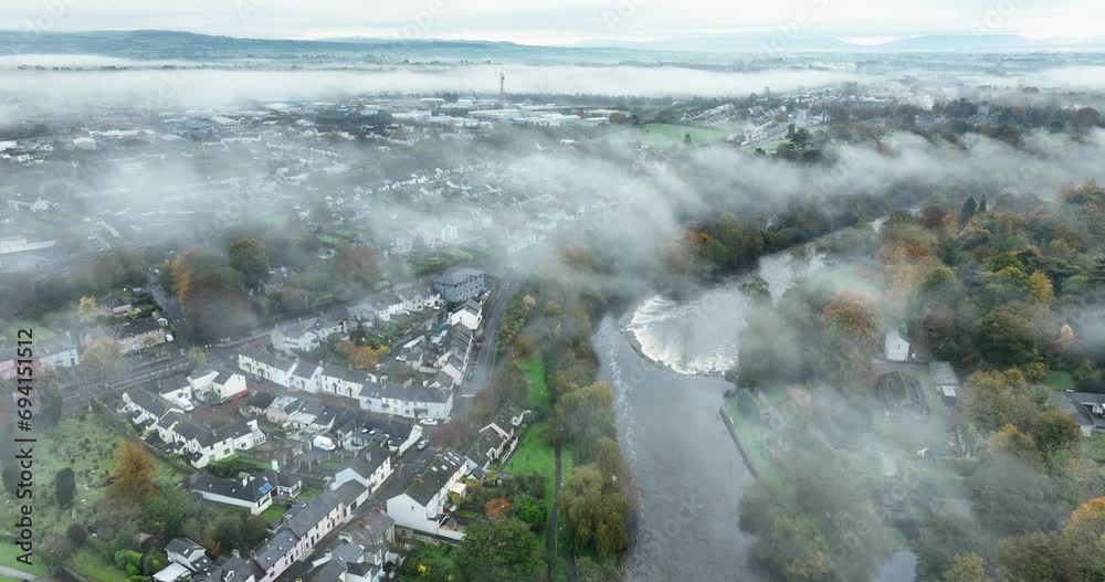 The top of the deep fog in the small town near the river