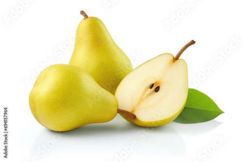 A couple of pears cut in half on a white surface.