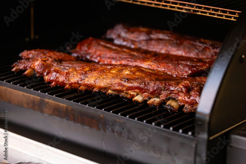 Fotografie, Obraz Smoked baby back pork ribs cooked on a pellet grill