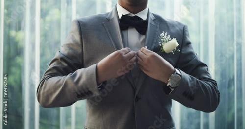 Button, wedding or hands of man with fashion, marriage or confidence for ceremony, love or celebration. Person, gentleman or groom with suit, bow tie or pride ready for event with blazer or style photo