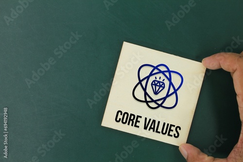 handheld stick with icons and word core values. the concept of basic values ​​or core values photo