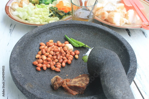The ingredients for making Indonesian food called lotek are on the table photo