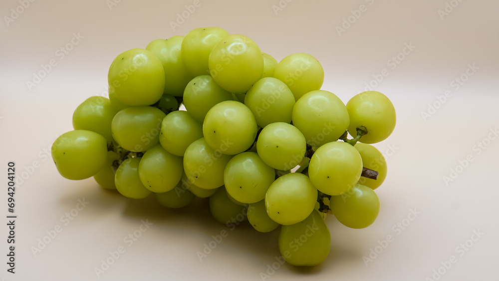 Shine Muscat isolated on white background. Japanese green grapes.