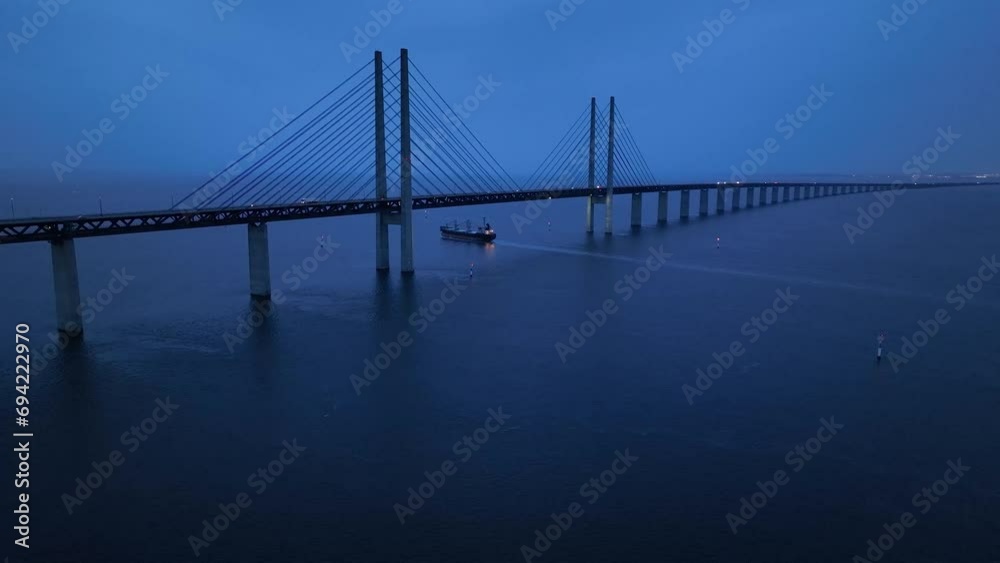 Panoramic Aerial view of Oresund Bridge who is a combined motorway and railway, sea bridge between Denmark and Sweden (Copenhagen and Malmo) and ship - seascape of Baltic Sea, Europe from above Panoramic Aerial view of Oresund Bridge who is a combined motorway and railway, sea bridge between Denmark and Sweden (Copenhagen and Malmo) and ship - seascape of Baltic Sea, Europe from above