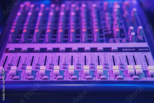 Close up of sound mixer in recording studio, shallow depth of field
