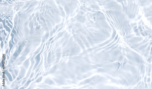 Water waves surface hits the sunlight (soft image). Blue swimming pool water background. 