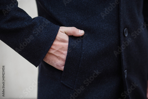 Detail of men's outerwear, fashionable men's black coat