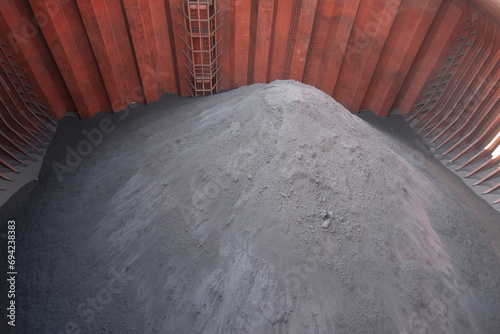 iron ore pile inside cargo hold of capesize bulk carrier photo